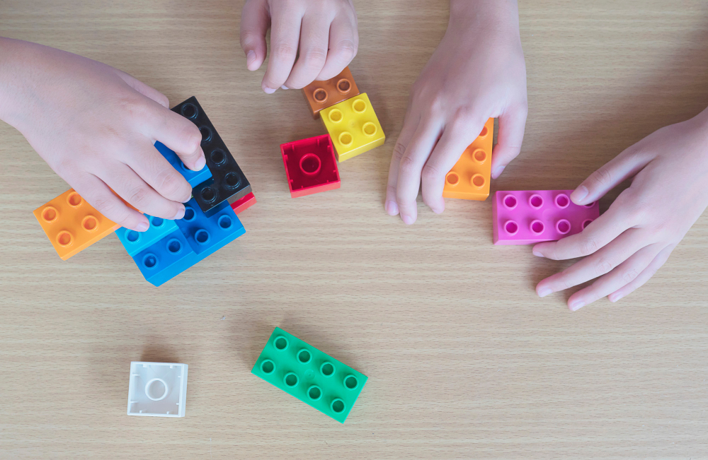 Kids playing pieces plastic creative construction blocks